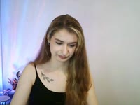 Hey, I’m Nina – blonde hair, green eyes, and tattoos that love to tell their own stories. My taste in music? Somewhere between Doja Cat’s groove and Rammstein’s fire ? I adore singing, dancing, and just vibing with the right energy. Sometimes I’m your sweet daydream, sometimes your wild rock chick – depends on which song is playing ?